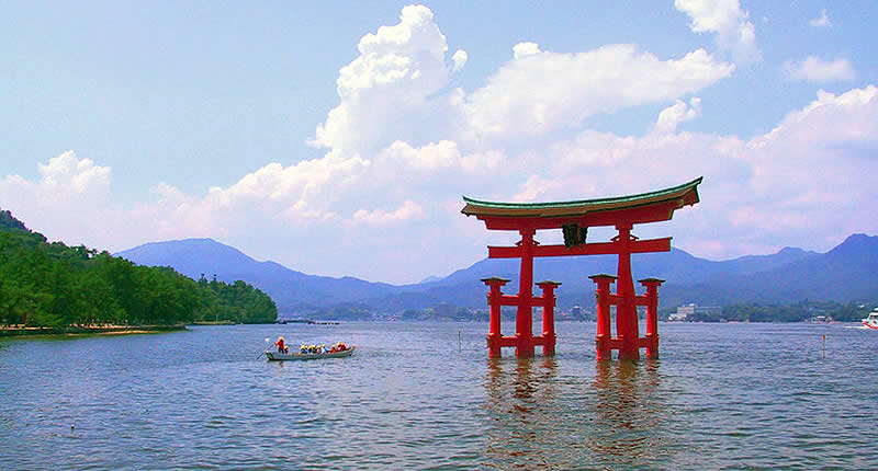 Travel Japan - A Japanese torii at dusk at Itsukushima Shrine