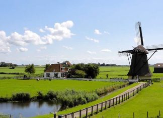 Netherlands - landscape photo - green fields - mill