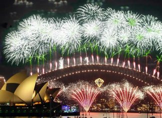 Harbour Bridge and Sydney Opera House in lights of New Year's Eve festive fireworks - Australia