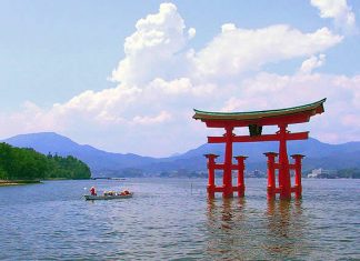 Travel Japan - A Japanese torii at dusk at Itsukushima Shrine